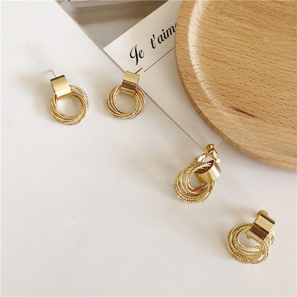 Ins cold wind metal circle geometric earrings female Korean ring winding earrings net red tide earrings F122